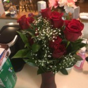 Preserving Dried Roses - red roses and baby's breath in a vase