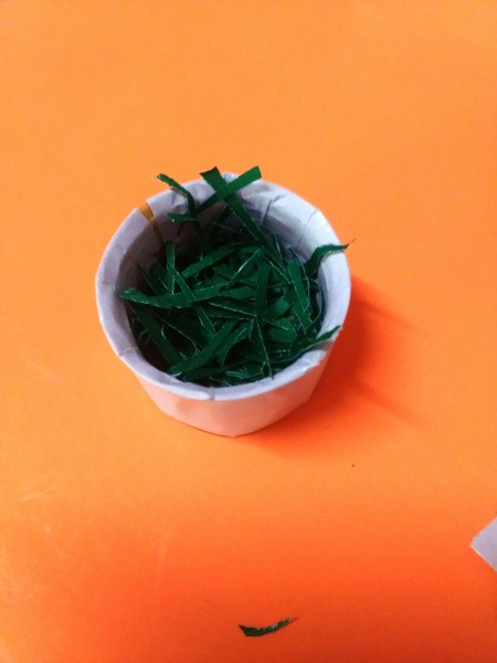 Bottle Cap Mini Flower Basket - pour some glue into the cap and add paper trimmings
