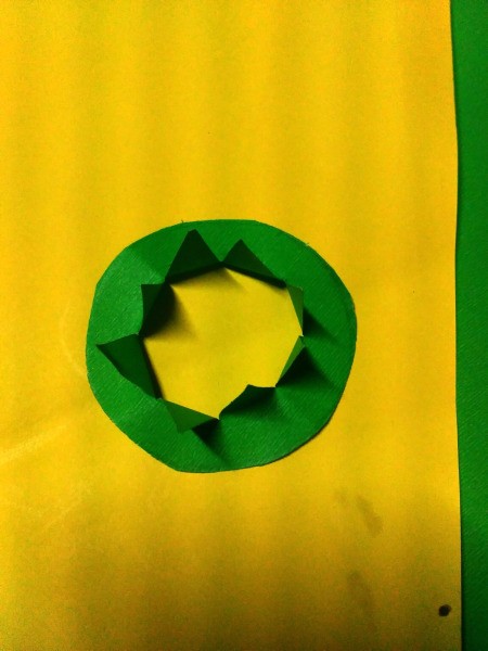 Mini Shamrock Hat Basket - cut it out and cut from the center of the inner circle out to its edge, fold the resulting triangles up