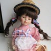 Identifying a Porcelain Cracker Barrel Doll - patriotic doll wearing a straw hat