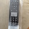 A remote in a plastic bag with bubble wrap on the bottom.