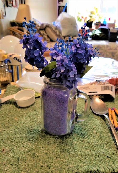 Vase of Many Colors - purple flowers in purple sand