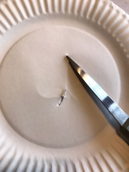 Paper Plate Aquarium Toddler Craft - punch a hole in the center of the second paper plate cut out around the fluted rim