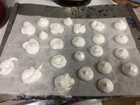 Vegan Meringue cookies on parchment paper