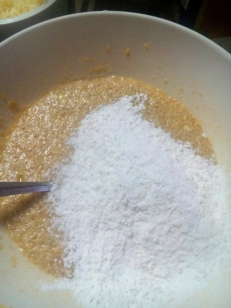 adding part of flour to sugar mixture