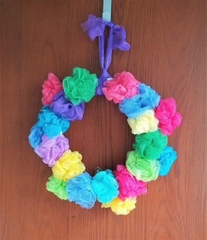 Spring Pouf Wreath - finished wreath hanging on a wall