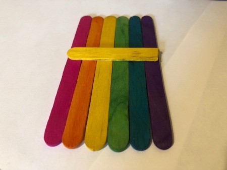 Pot O' Gold Piggy Bank - lay out colored sticks in rainbow order and glue the half stick to them