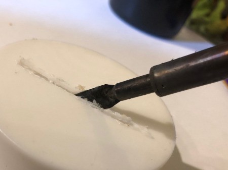 Pot O' Gold Piggy Bank - warm up the hot knife and cut a slit in the plastic jar lid