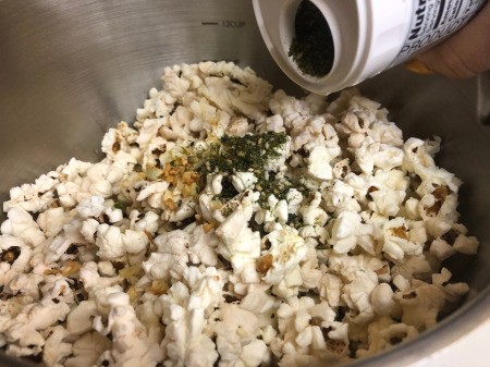 shaking Furikake on Popcorn