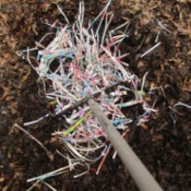 Homemade Compost - The Natural Way To Green Gardening - mixing materials with a rake