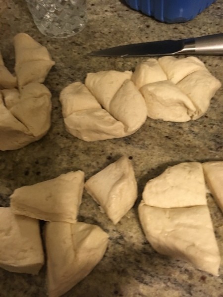 Refrigerator biscuits cut into quarters.