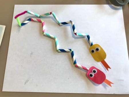 Making a Paper Drinking Straw Snake - bend the pipe cleaners into zig zag shapes, ready to play