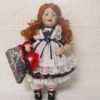 Value of a Marie Osmond Porcelain Doll - red headed doll