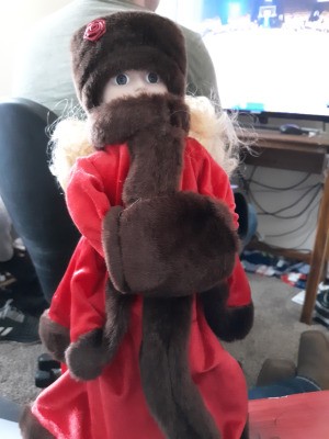 Identifying a Tiffany Russian Porcelain Doll - doll wearing a fur hat, muff, and fur trimmed long red coat