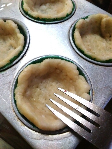 pricking dough with fork