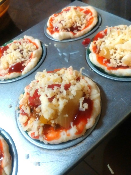 cheese sprinkled on Sardine Pizza Cups