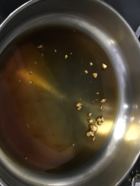 vinegar, oil, and seasonings in pan
