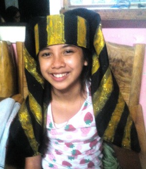 Making an Egyptian Headdress - smiling child wearing the headdress