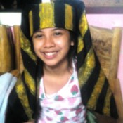 Making an Egyptian Headdress - smiling child wearing the headdress