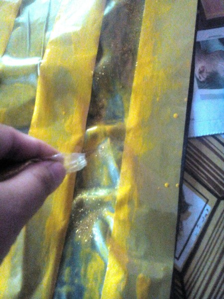 Making an Egyptian Headdress - sprinkle with gold glitter and set aside to dry