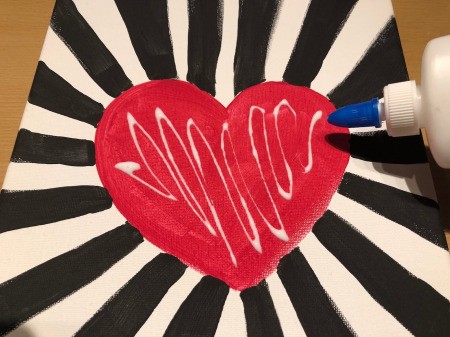 Making a Mural from Beans - once the paint is dry apply white glue to an area