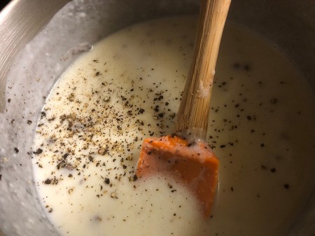 adding spices to sauce