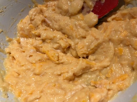 mixing chicken, cheese & eggs