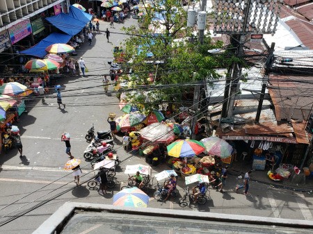 Vendors selling flowers outside.