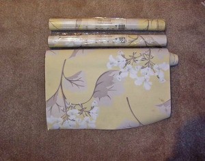 Finding Discontinued Laura Ashley Wallpaper - rolls of wallpaper on carpet