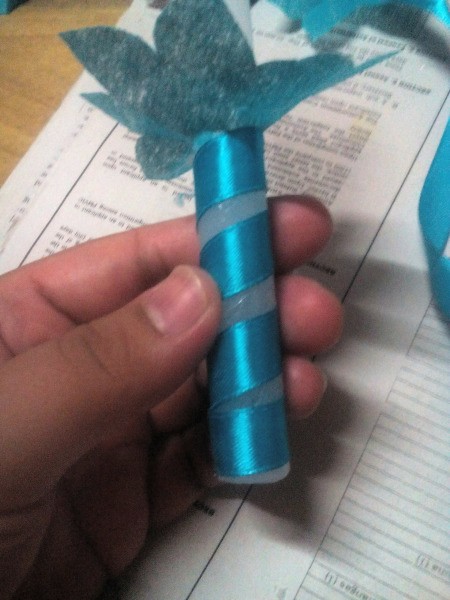 Christening Candles with Drip Catcher - wrap candles with ribbon starting under the flower and glue in place