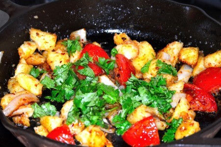 Fried Potatoes, onions tomatoes & cilantro