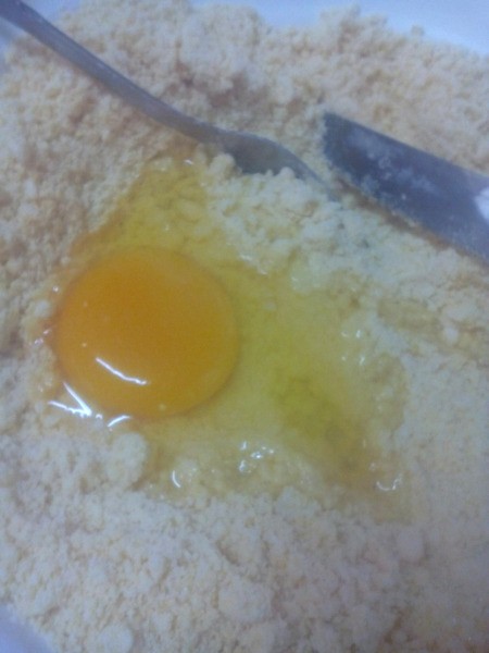 mixing egg in dough