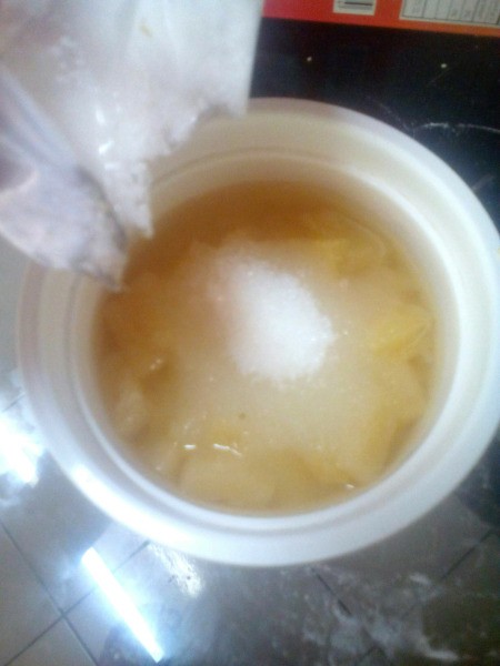 adding sugar to pineapple chunks