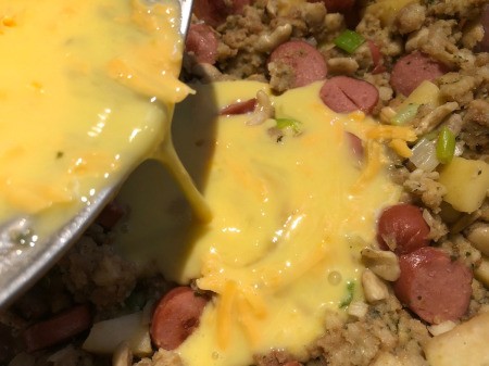 pouring egg on stuffing mix