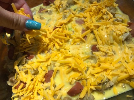 Adding the cheese to top of casserole