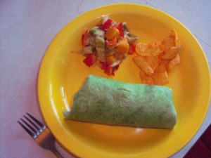 Avocado Mango Salsa on plate with filled tortilla