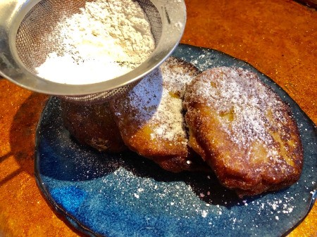 dusting Fritters with powdered sugar