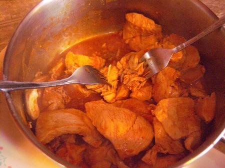 shredding chicken in pot