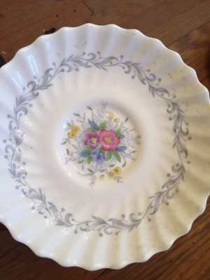 Determining the Value of Old Estate China - scalloped plate with blue floral pattern around the near edge and floral pattern in the center