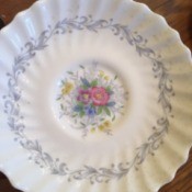 Determining the Value of Old Estate China - scalloped plate with blue floral pattern around the near edge and floral pattern in the center