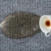 A coffee stain on an upholstered.