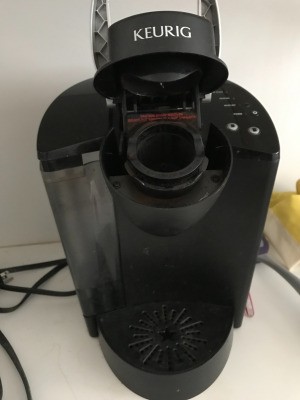 A Keurig coffee maker on a countertop.