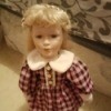 Identifying a Porcelain Doll - doll in plaid dress with a white collar