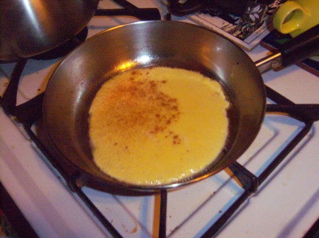 batter in pan with cinnamon on it