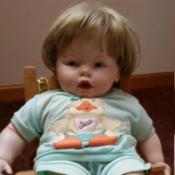 Identifying a Ceramic or Porcelain Doll - baby doll sitting on a chair