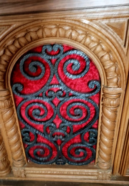 Wrought iron decoration on a console stereo system.