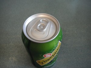 Using a Straw in a Soda Can - can of ginger ale
