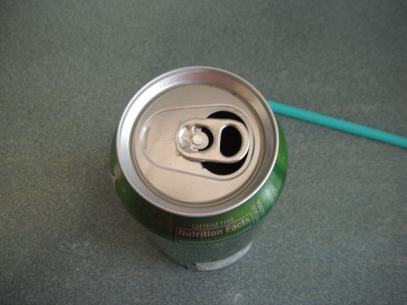 Using a Straw in a Soda Can - turn tab back over the hole