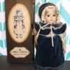 Finding the Value of Vintage Porcelain Dolls - musical doll next to box
