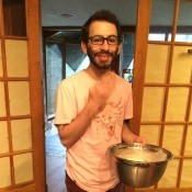 man holding bowl of popcorn